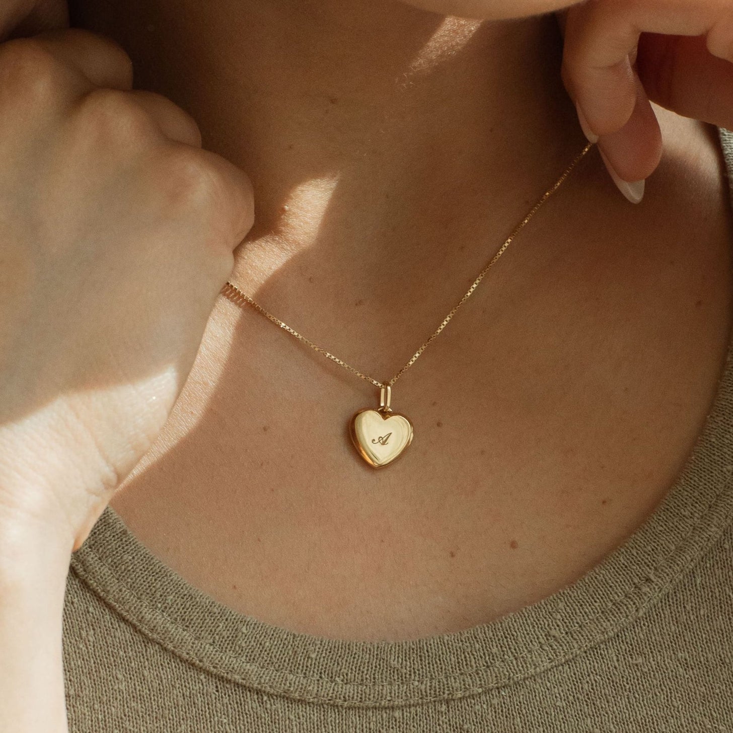 Custom engraved initial on a heart pendant necklace