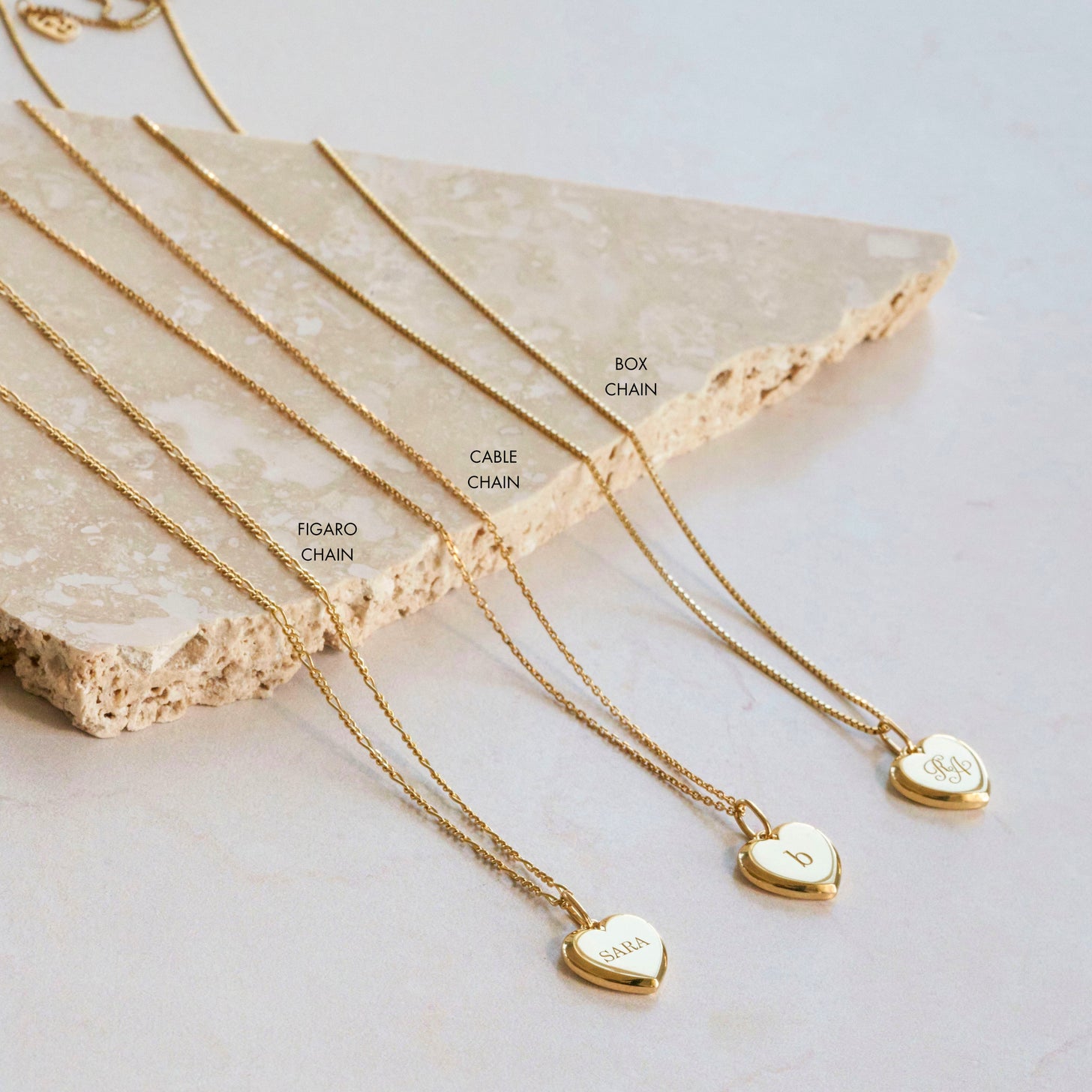 Figaro chain, cable chain, and box chain options for the engraved Eva Heart Necklace pendants
